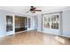 Sunroom featuring tile floors, bright lighting, and access to an outdoor deck at 3911 Ivy Ne Rd, Atlanta, GA 30342