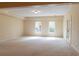 Large finished basement area with recessed lighting and access to the backyard at 3955 Graystone Preserve Pl, Cumming, GA 30040