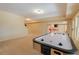 Finished basement with air hockey table and lots of room to play at 3955 Graystone Preserve Pl, Cumming, GA 30040