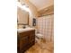 Bathroom features a framed mirror, wood vanity and decorative paint at 3955 Graystone Preserve Pl, Cumming, GA 30040