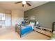 This bedroom has two beds, a cool color scheme, and a view to the upstairs landing at 3955 Graystone Preserve Pl, Cumming, GA 30040