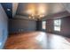 Spacious bonus room with hardwood flooring and tray ceilings offer great natural light at 3955 Graystone Preserve Pl, Cumming, GA 30040