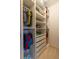 Walk-in closet with custom shelving and drawers for optimal organization and storage at 3955 Graystone Preserve Pl, Cumming, GA 30040