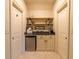 Convenient coffee bar with shelves, cabinets, a mini-fridge, and ample counter space at 3955 Graystone Preserve Pl, Cumming, GA 30040