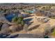 Aerial view showcases community amenities, a lake with a fountain, a pool, and a playground at 3955 Graystone Preserve Pl, Cumming, GA 30040