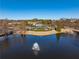 View of a neighborhood lake and community clubhouse offering stunning scenery and recreational opportunities at 3955 Graystone Preserve Pl, Cumming, GA 30040