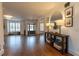 Welcoming entryway with hardwood floors, console table, and plenty of natural light at 3955 Graystone Preserve Pl, Cumming, GA 30040