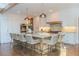 Spacious kitchen boasts a large island, sleek lighting, and plenty of cabinet space at 3955 Graystone Preserve Pl, Cumming, GA 30040