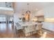 Beautiful kitchen features white cabinets, large island with seating, and stainless steel appliances at 3955 Graystone Preserve Pl, Cumming, GA 30040