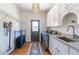 Well-lit laundry room with modern washer and dryer, ample counter space, and storage at 3955 Graystone Preserve Pl, Cumming, GA 30040