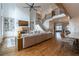 Spacious living room with fireplace, built-in shelves, and staircase to the second floor at 3955 Graystone Preserve Pl, Cumming, GA 30040