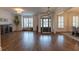 Inviting living room with shutters and hardwood floors, illuminated by natural light at 3955 Graystone Preserve Pl, Cumming, GA 30040