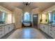 Luxurious bathroom boasts dual vanities, stand alone tub, a window, and a separate shower at 3955 Graystone Preserve Pl, Cumming, GA 30040
