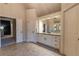 Bright bathroom with a large mirror, vanity, storage, and natural light at 3955 Graystone Preserve Pl, Cumming, GA 30040