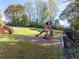 Backyard playground featuring a swing set, slide, and pea gravel surface at 3955 Graystone Preserve Pl, Cumming, GA 30040