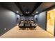 Home theater with comfortable seating, projector, and surround sound speakers at 3955 Graystone Preserve Pl, Cumming, GA 30040