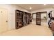 Large walk-in closet featuring custom organization systems for shoes, clothing, and accessories at 3955 Graystone Preserve Pl, Cumming, GA 30040
