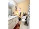 Bright bathroom featuring a modern sink, stylish chevron shower curtain and artistic wall decorations at 884 Poole Bridge Rd, Hiram, GA 30141