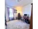 Bedroom featuring carpet, window with curtains, desk, bookcase, and storage cabinet at 884 Poole Bridge Rd, Hiram, GA 30141