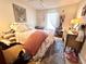 Cozy bedroom with carpet, a queen bed, dresser, window and throw rug at 884 Poole Bridge Rd, Hiram, GA 30141