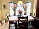 Charming dining area with a decorative chandelier, creating a warm and inviting space at 884 Poole Bridge Rd, Hiram, GA 30141