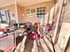 Covered porch with seating, wood deck, and views of the surrounding property at 884 Poole Bridge Rd, Hiram, GA 30141