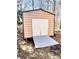 Tan shed with a metal roof, white double doors, concrete ramp and set on blocks at 884 Poole Bridge Rd, Hiram, GA 30141