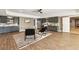 Basement with a bar/kitchenette, lounge area, and luxury vinyl plank flooring at 12867 Etris Walk, Roswell, GA 30075