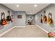 Finished basement featuring guitars and a drumset for the music enthusiast at 12867 Etris Walk, Roswell, GA 30075
