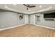 Finished basement featuring luxury vinyl plank floors, recessed lighting, and a TV area at 12867 Etris Walk, Roswell, GA 30075