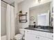 Bathroom with a bathtub/shower combo and a modern sink vanity at 12867 Etris Walk, Roswell, GA 30075