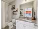 Bathroom features a shower-tub combo, floating shelves and granite countertops at 12867 Etris Walk, Roswell, GA 30075