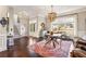 Open-concept dining area with hardwood floors and natural light flowing through the large windows at 12867 Etris Walk, Roswell, GA 30075
