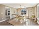 Cozy dining room featuring a round table, comfortable seating, and natural light at 12867 Etris Walk, Roswell, GA 30075