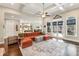 Spacious living room featuring hardwood floors, coffered ceilings, and large windows at 12867 Etris Walk, Roswell, GA 30075
