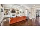 Bright living room features coffered ceilings, fireplace, built-in shelves, and a large sofa for comfortable living at 12867 Etris Walk, Roswell, GA 30075