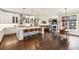 The open floorplan showcases a modern kitchen, dining area, and cozy living room with ample natural light at 12867 Etris Walk, Roswell, GA 30075