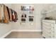 Walk-in closet with wire shelving and a decorative dresser at 12867 Etris Walk, Roswell, GA 30075