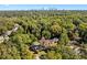 View of the home in a wooded neighborhood with skyline in the background at 1819 Avon Ave, Atlanta, GA 30311