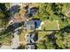 Birds eye view of the house situated on its lot, surrounded by mature trees and lush landscaping at 1819 Avon Ave, Atlanta, GA 30311