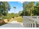 Spacious fenced backyard with lush green grass and a concrete pad, perfect for outdoor activities and relaxation at 1819 Avon Ave, Atlanta, GA 30311