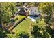 Home's fenced backyard featuring a lush lawn and a newly installed concrete driveway at 1819 Avon Ave, Atlanta, GA 30311