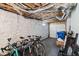 Unfinished basement with a painted stone wall, offering lots of storage space with bicycle and some boxes at 1819 Avon Ave, Atlanta, GA 30311