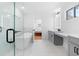 A stylish bathroom features a soaking tub and a vanity with marble-like countertops at 1819 Avon Ave, Atlanta, GA 30311