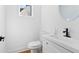 Bathroom with a white vanity, modern faucet, and updated fixtures at 1819 Avon Ave, Atlanta, GA 30311