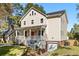 Beautifully renovated two-story home featuring a welcoming front porch and garage at 1819 Avon Ave, Atlanta, GA 30311