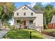 Charming two-story home with a welcoming front porch and well-manicured lawn at 1819 Avon Ave, Atlanta, GA 30311