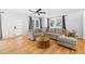 Comfortable living room features hardwood floors, a large sectional sofa, and abundant natural light at 1819 Avon Ave, Atlanta, GA 30311