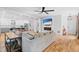 Spacious living room with hardwood floors seamlessly connects to an open kitchen and dining area at 1819 Avon Ave, Atlanta, GA 30311