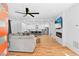 Bright, open-concept living room with a fireplace, hardwood floors, and seamless flow to the kitchen at 1819 Avon Ave, Atlanta, GA 30311